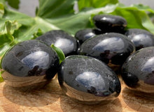 Load image into Gallery viewer, Black Tourmaline Tumbles and Palm Stones - Amethyst Aura Moon
